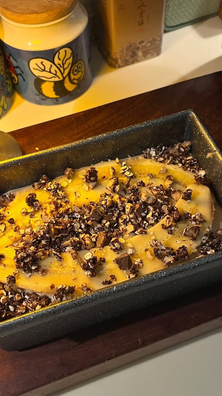 banana bread mid-prep, granola on top